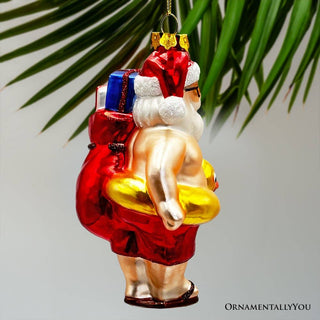 Santa on Summer Vacation Glass Ornament