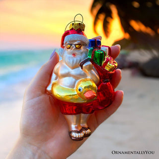 Santa on Summer Vacation Glass Ornament